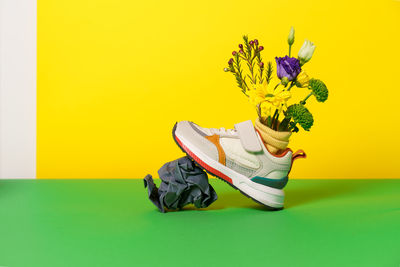 Close-up of yellow flowers on table