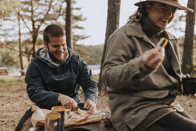 Couple having picnic at lake