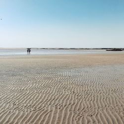 Scenic view of beach against clear sky