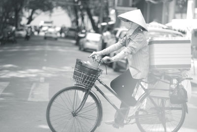 Man riding bicycle on street