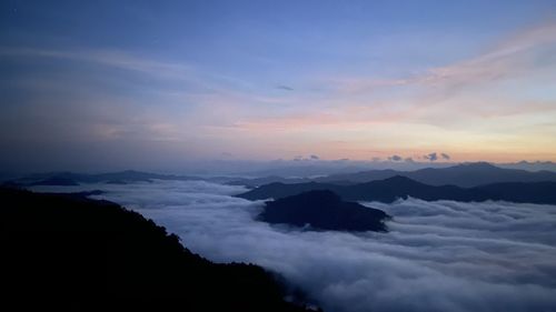 Scenic view of mountains against sky during sunset