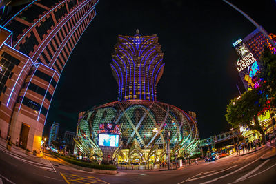 Low angle view of illuminated buildings at night