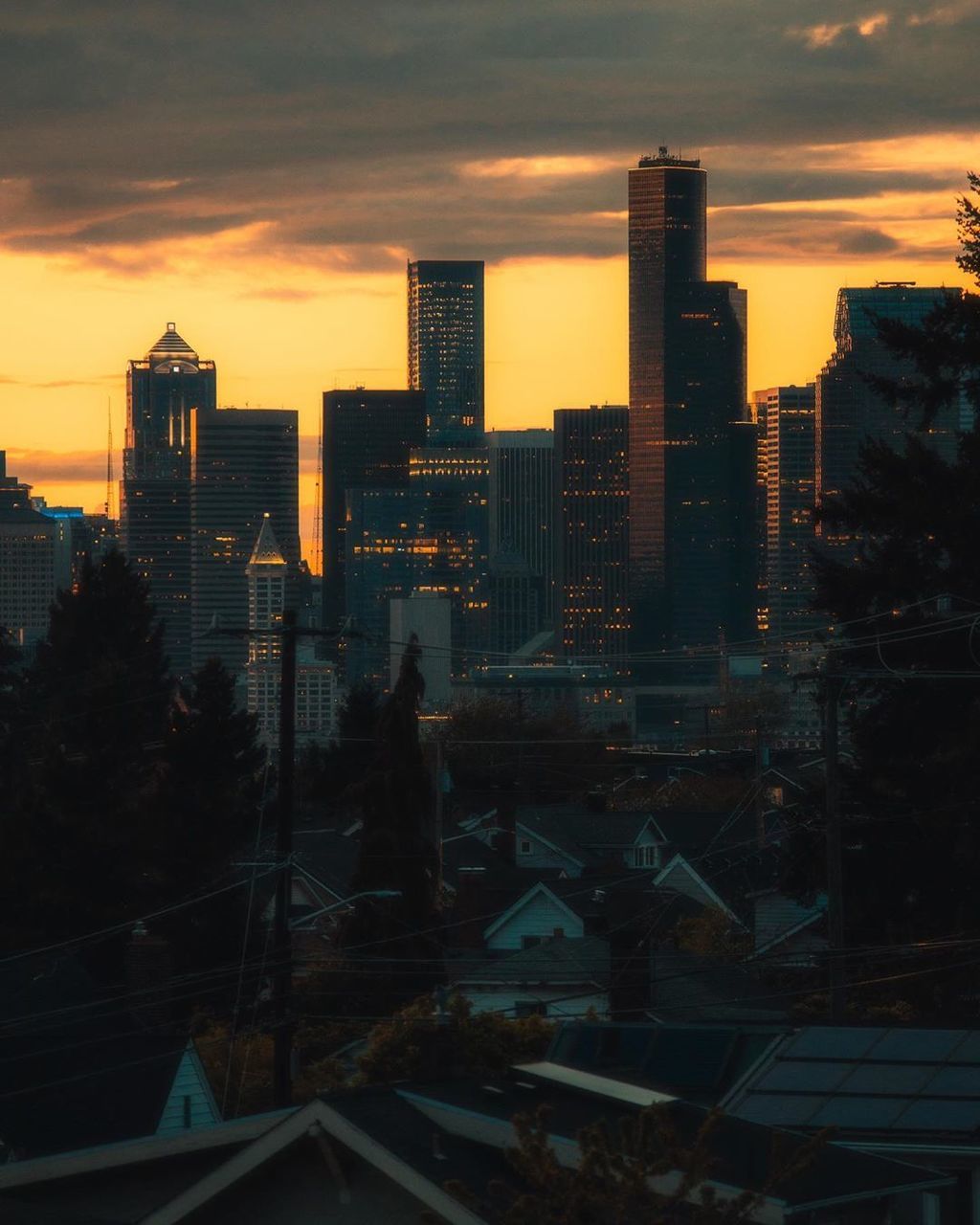 DIGITAL COMPOSITE IMAGE OF BUILDINGS AGAINST SKY AT SUNSET