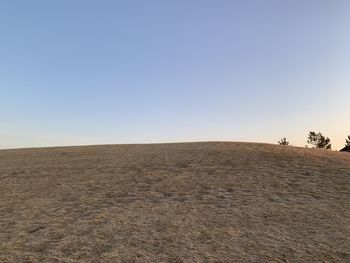 Scenic view of desert against clear sky