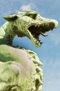 Close-up of statue against sky