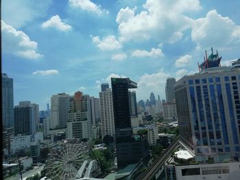 Modern buildings in city against sky