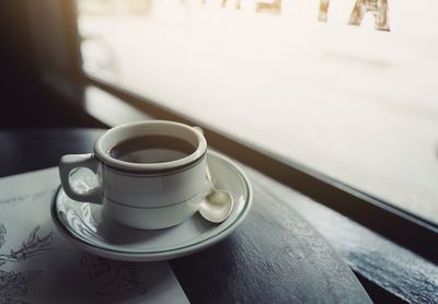 High angle view of coffee cup on table