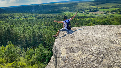 Full length of woman standing on rock