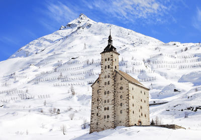 Building against sky during winter