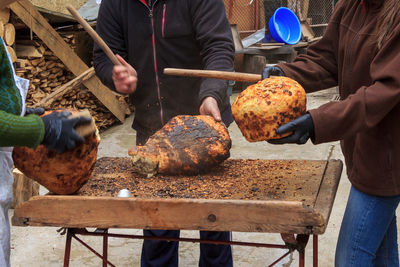 Group of people preparing food on table