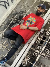 High angle portrait of man sitting on floor