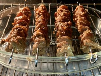 High angle view of meat on barbecue grill