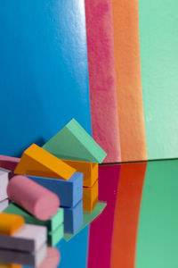 Close-up of toys against blue wall