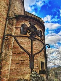 Low angle view of clock tower against sky