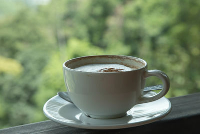 Close-up of coffee cup on table