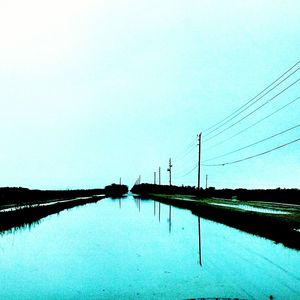 Calm sea against clear sky