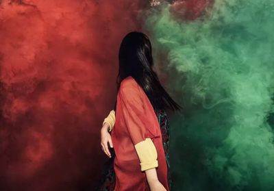 Woman standing in the dark