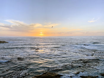 Scenic view of sea against sky during sunset