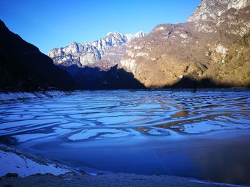 Scenic view of frozen lake against sky