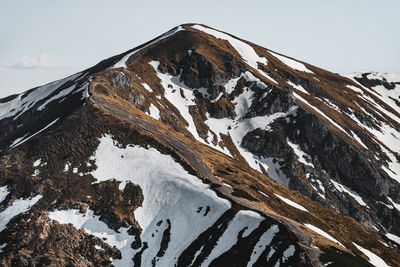 Snow covered mountain against sky