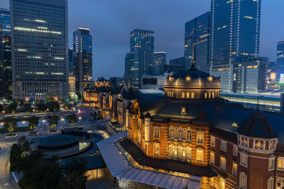 Illuminated modern buildings in city at night