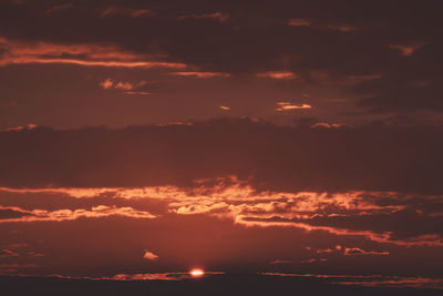 Low angle view of dramatic sky during sunset