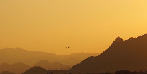 Silhouette of hot air balloon against clear sky