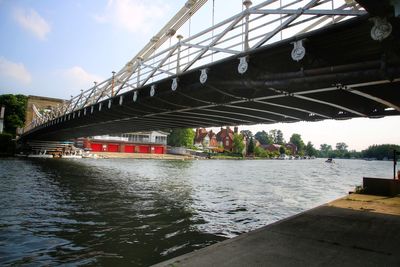 Bridge over river against sky