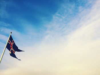 Low angle view of flag against sky