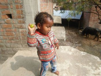 Boy standing outdoors