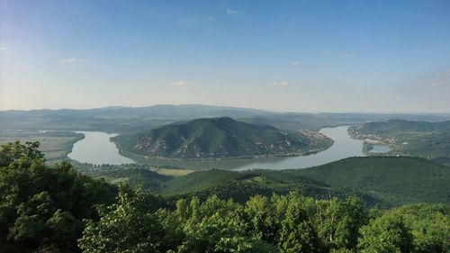 Scenic view of landscape and river against sky