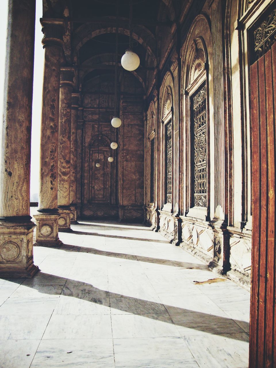 architecture, built structure, architectural column, arch, indoors, column, history, corridor, religion, place of worship, the way forward, colonnade, entrance, historic, old, spirituality, building exterior, church, door, pillar