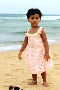 Portrait of girl standing at beach