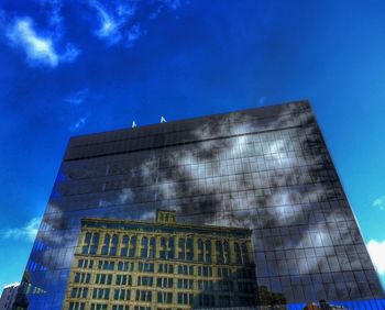 Low angle view of building against blue sky