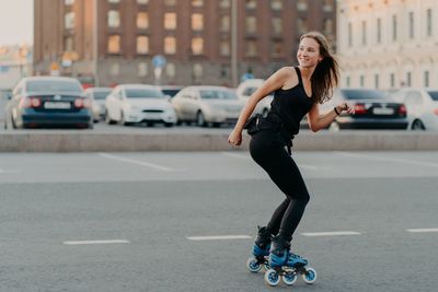 Full length of woman on street in city