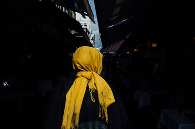 Woman standing in front of building