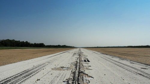 Scenic view of road against clear sky