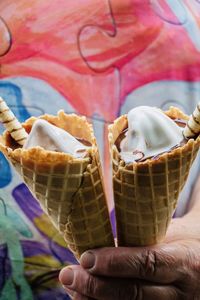 Close-up of hand holding ice cream