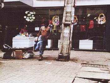 Full length of woman standing on railing