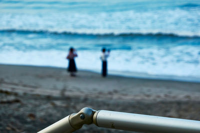 People on beach by sea