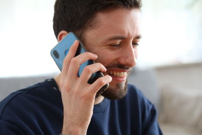 Portrait of man using mobile phone
