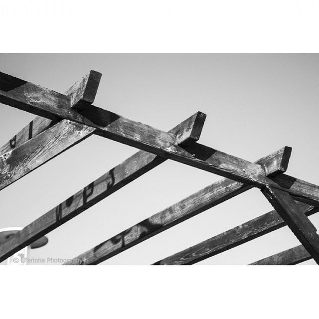 low angle view, built structure, clear sky, alternative energy, architecture, metal, environmental conservation, renewable energy, fuel and power generation, day, sky, wind power, no people, windmill, building exterior, outdoors, development, wind turbine, auto post production filter, industry