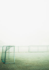 Soccer field against clear sky