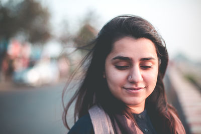 Close-up of young woman looking down