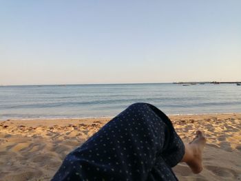 Scenic view of beach against clear sky