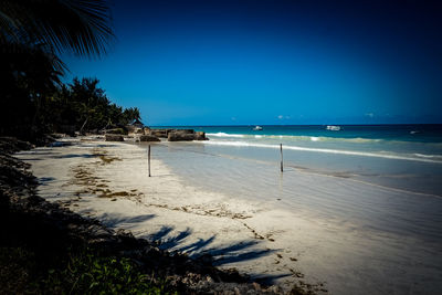 Scenic view of sea against blue sky