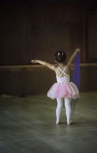 Rear view of ballet dancer in dance studio