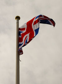 Low angle view of flag against sky