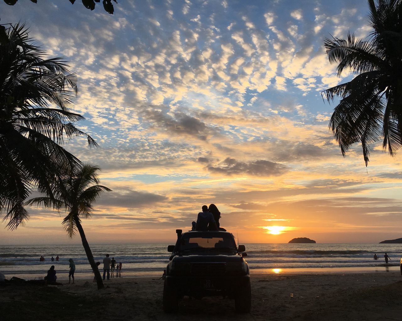 SCENIC VIEW OF BEACH DURING SUNSET