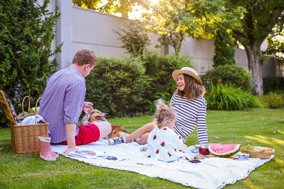 Family enjoying picnic at yard